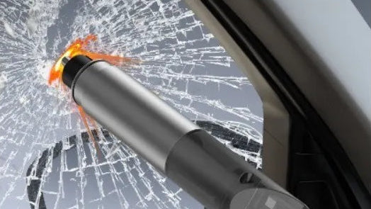 Car window breaker tool with shattered glass background